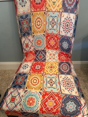 Set of 4 bold colored, mandala chair covers! Never used. Stretch to fit